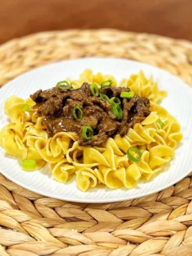 Boston Beef & Noodles with tender steak tips, egg noodles, and savory gravy