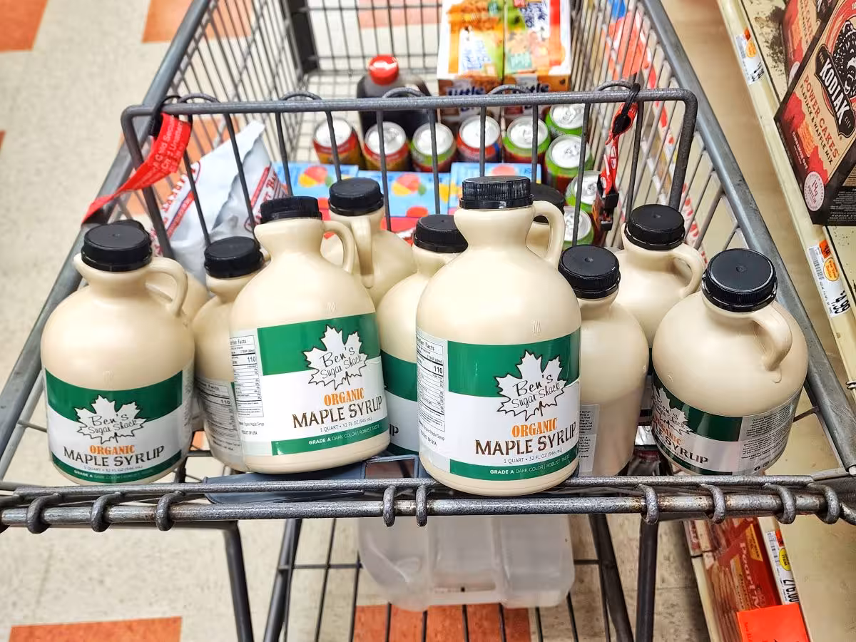 Shopping cart filled with jugs of pure maple syrup