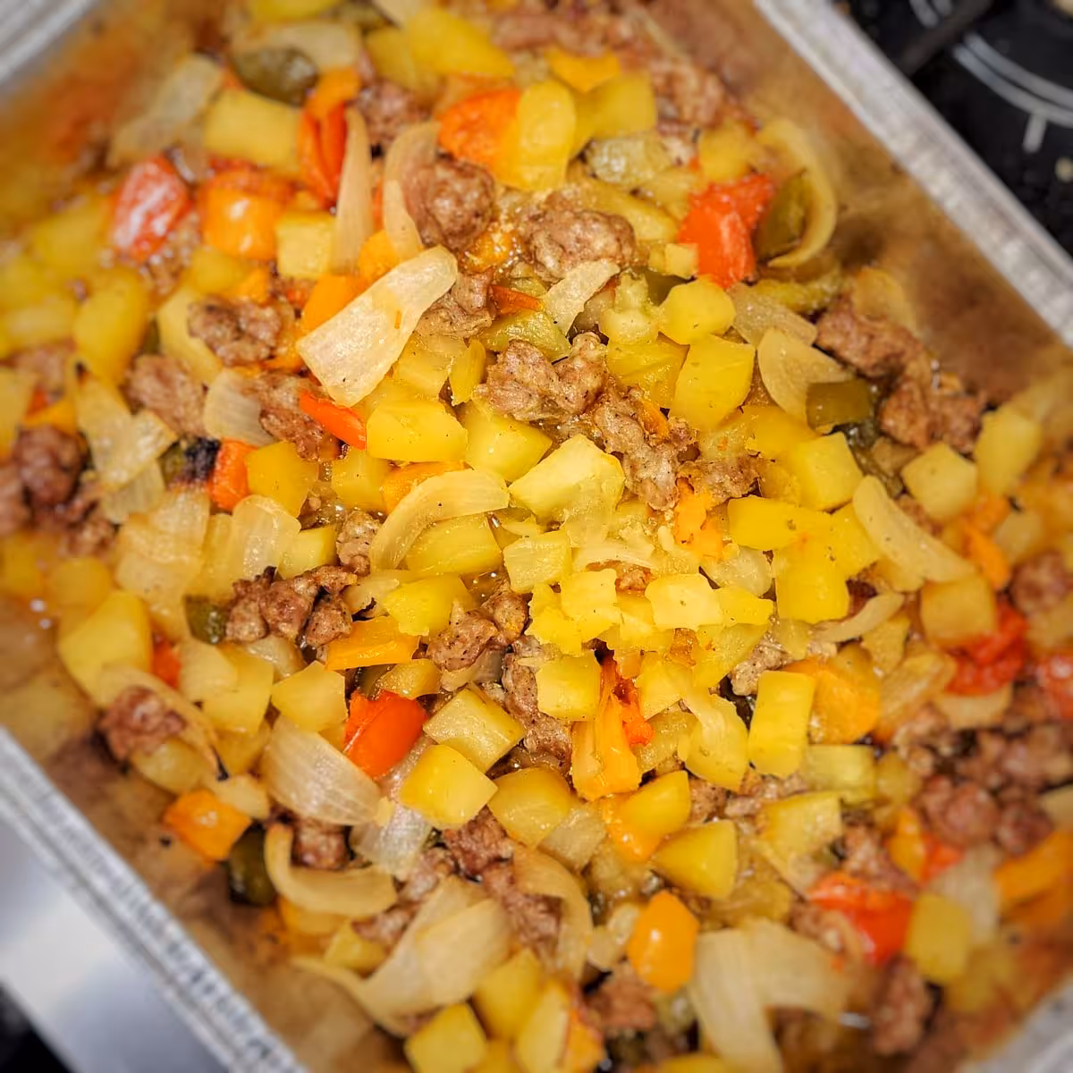 Peppers, onions, potatoes and sausage casserole baked until browned