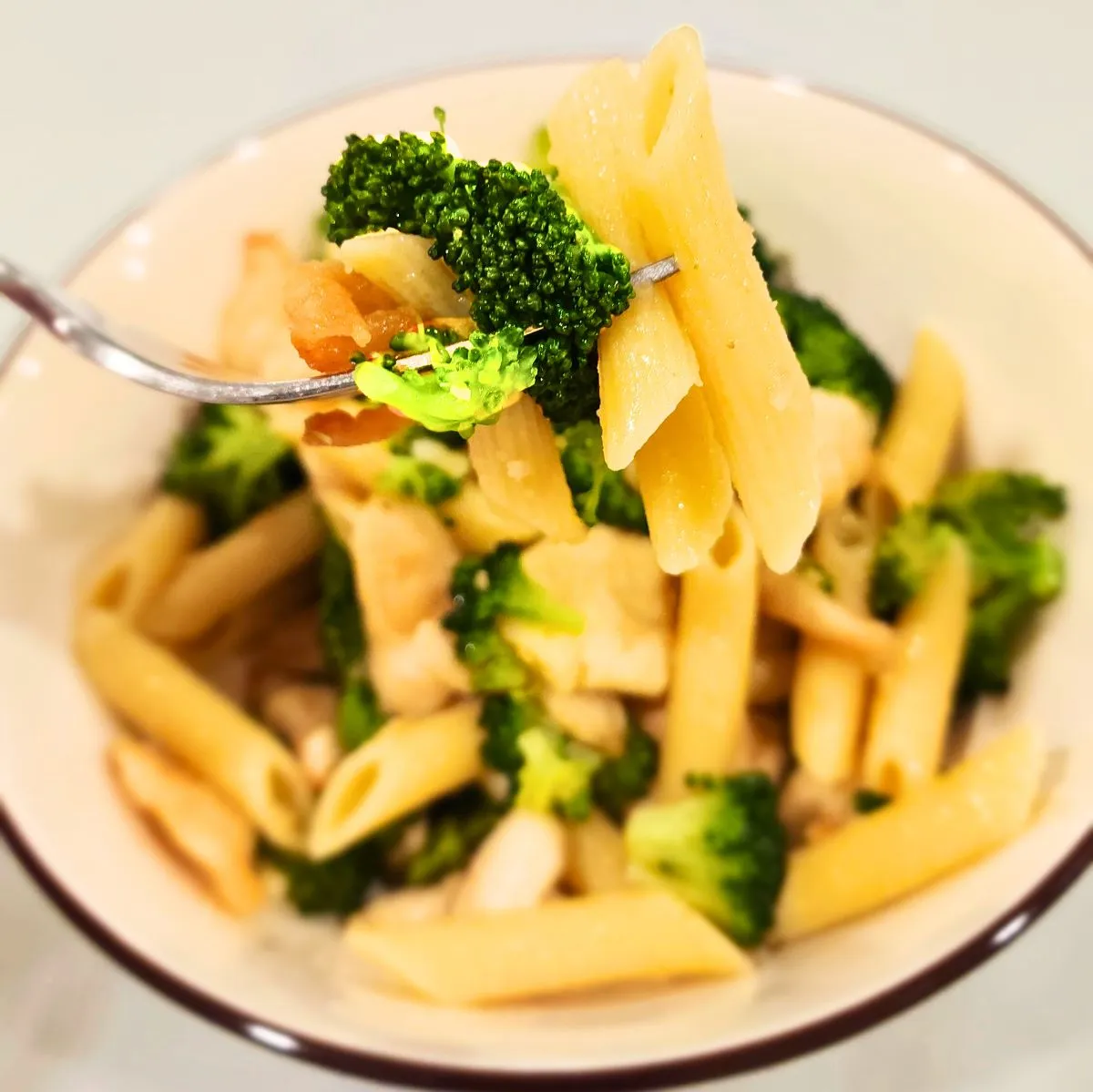 Forkful of chicken broccoli ziti with penne pasta